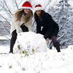 Two girls with a huge snowball
